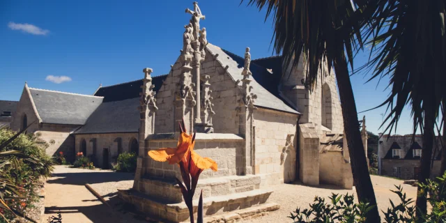 Notre Dame Izel Vor church from the side with the calvary in front