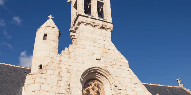 Front of Notre Dame church in La Forêt-Fouesnant with its bell tower and turret