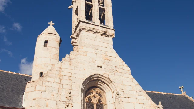 Front of Notre Dame church in La Forêt-Fouesnant with its bell tower and turret