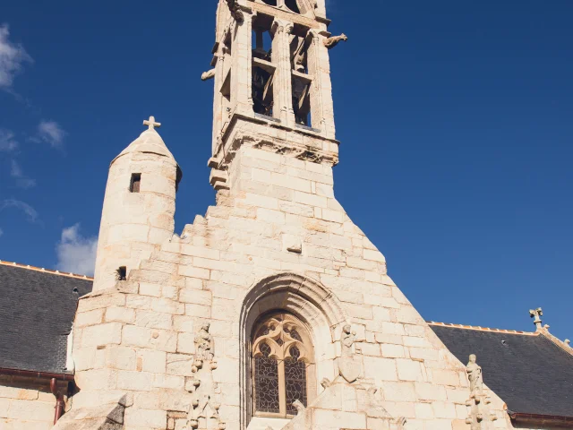Front of Notre Dame church in La Forêt-Fouesnant with its bell tower and turret